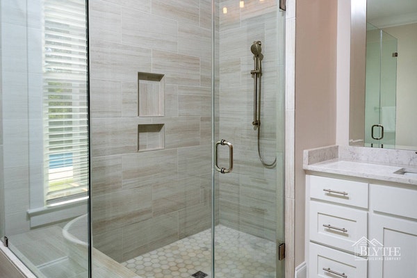 Oversized custom shower with glass enclosure