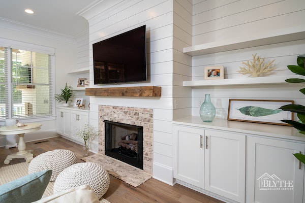 Shiplap image: shiplap above fireplace and behind built-in shelves