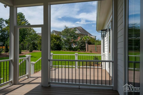 Screened-in-back-porch-with-green-yard-in-subdivision.jpg