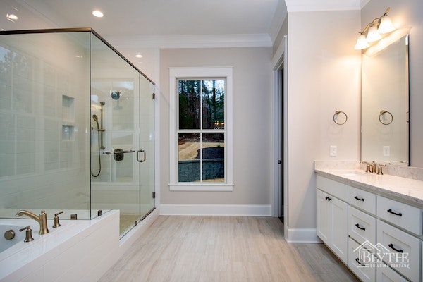 Custom Luxury Bathroom With Oversized Glass Shower And Separate Tub
