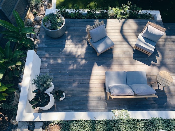 overhead shot of a deck with furniture and planters