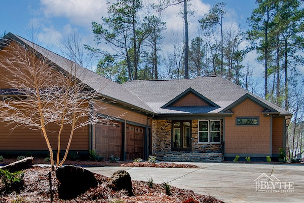 Custom Home With 4 Car Garage Stacked Stone Accents And Cedar Shingle Panel Accents = New Home in Lexington, SC