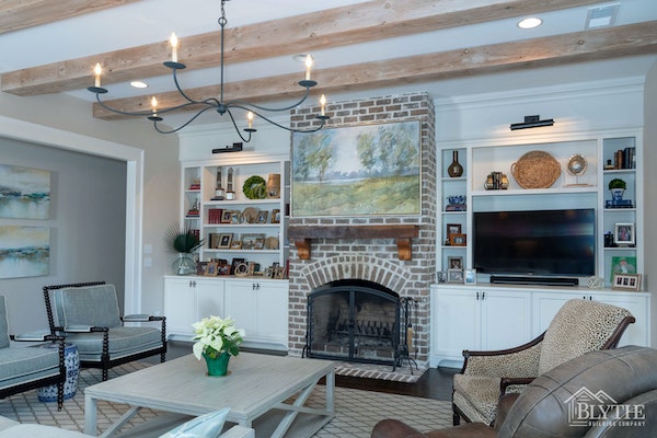 Exposed Beams and rustic brick fireplace and fireplace wall