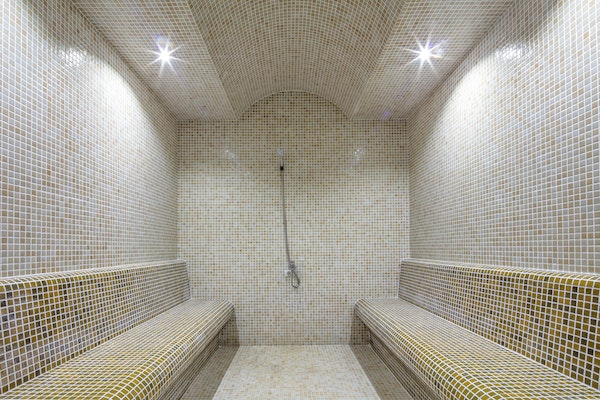 Steam room or Turkish bath in a luxury hotel with one-inch square tile.