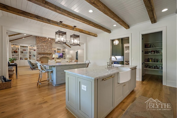 Modern Craftsman Kitchen With Two Kitchen Islands Rustic Hardwood Beams Oversized Pendant Lights And A Scullery