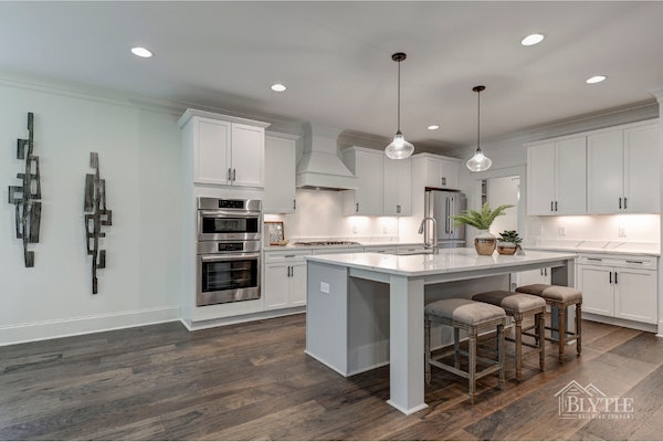 Modern Craftsman Kitchen With White Shaker Cabinets Large Eat In Island And Glass Pendant Lights