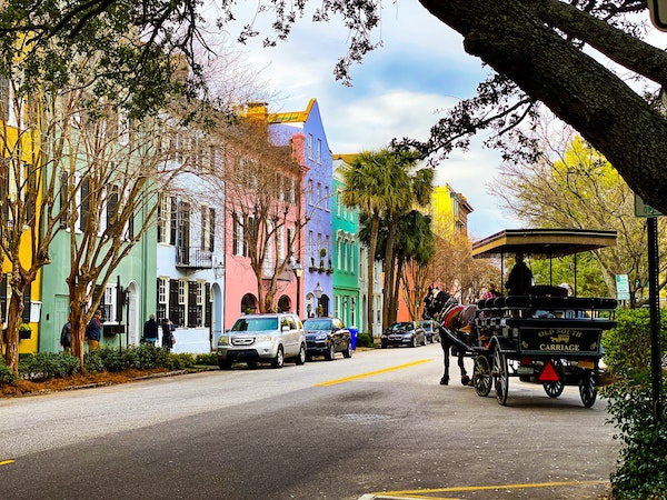 Rainbow Row in Charleston, SC wtih horse-drawn carriage